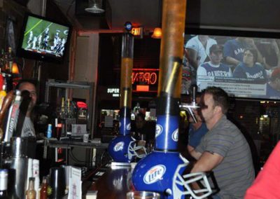Man watching sports at bar