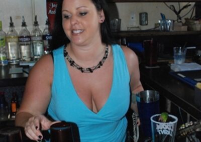 Lively Bar Atmosphere - Pour House Dallas - Bartender Serving Drinks