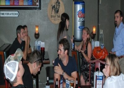 Lively Beer Enthusiasts Enjoying Time at The Pour House Dallas Pub